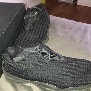 Size 8 future black jordans.